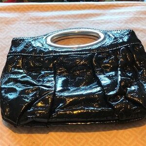 Nice looking clutch with metal handle and snap inside,  real clean, like new